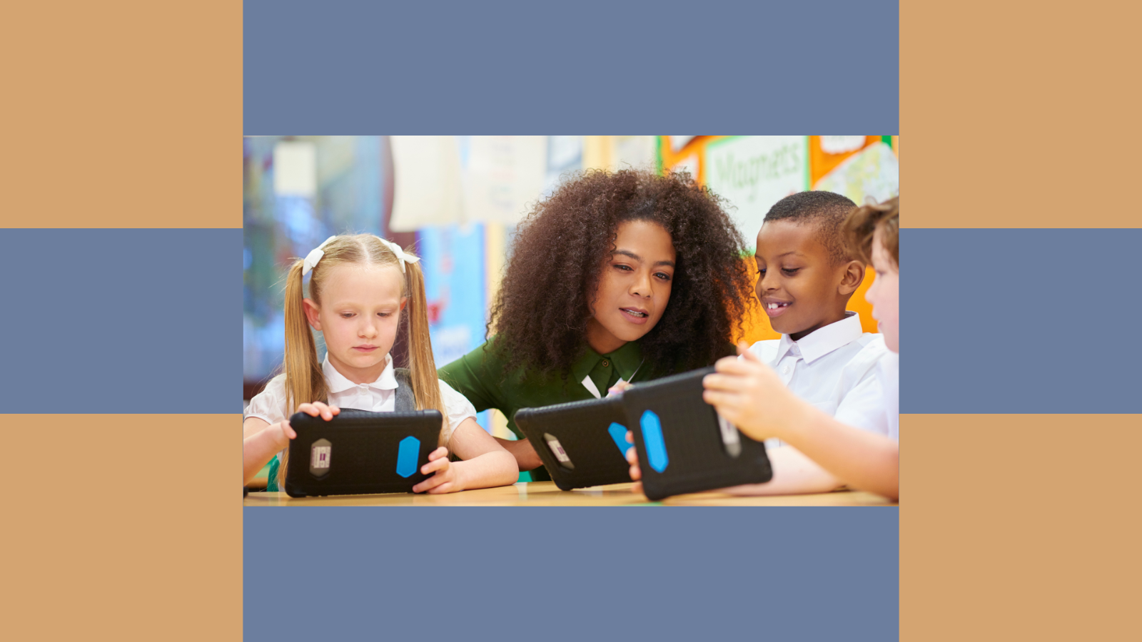 African American female teacher with elementary students looking at devices