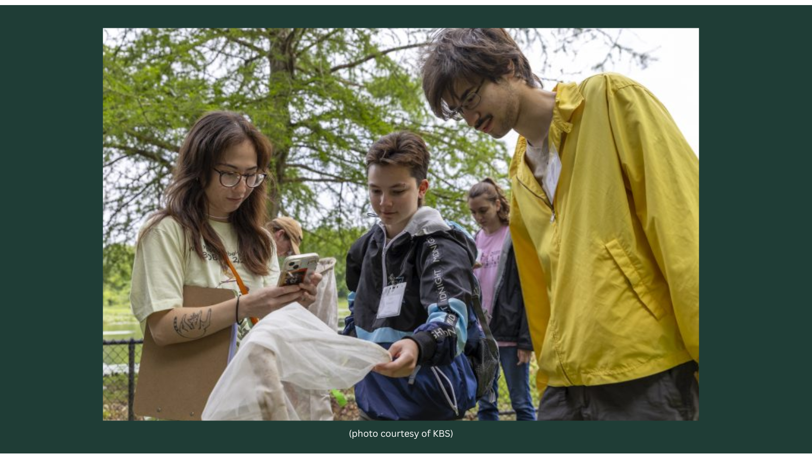 Stephanie Bristow showing volunteers something in bag
