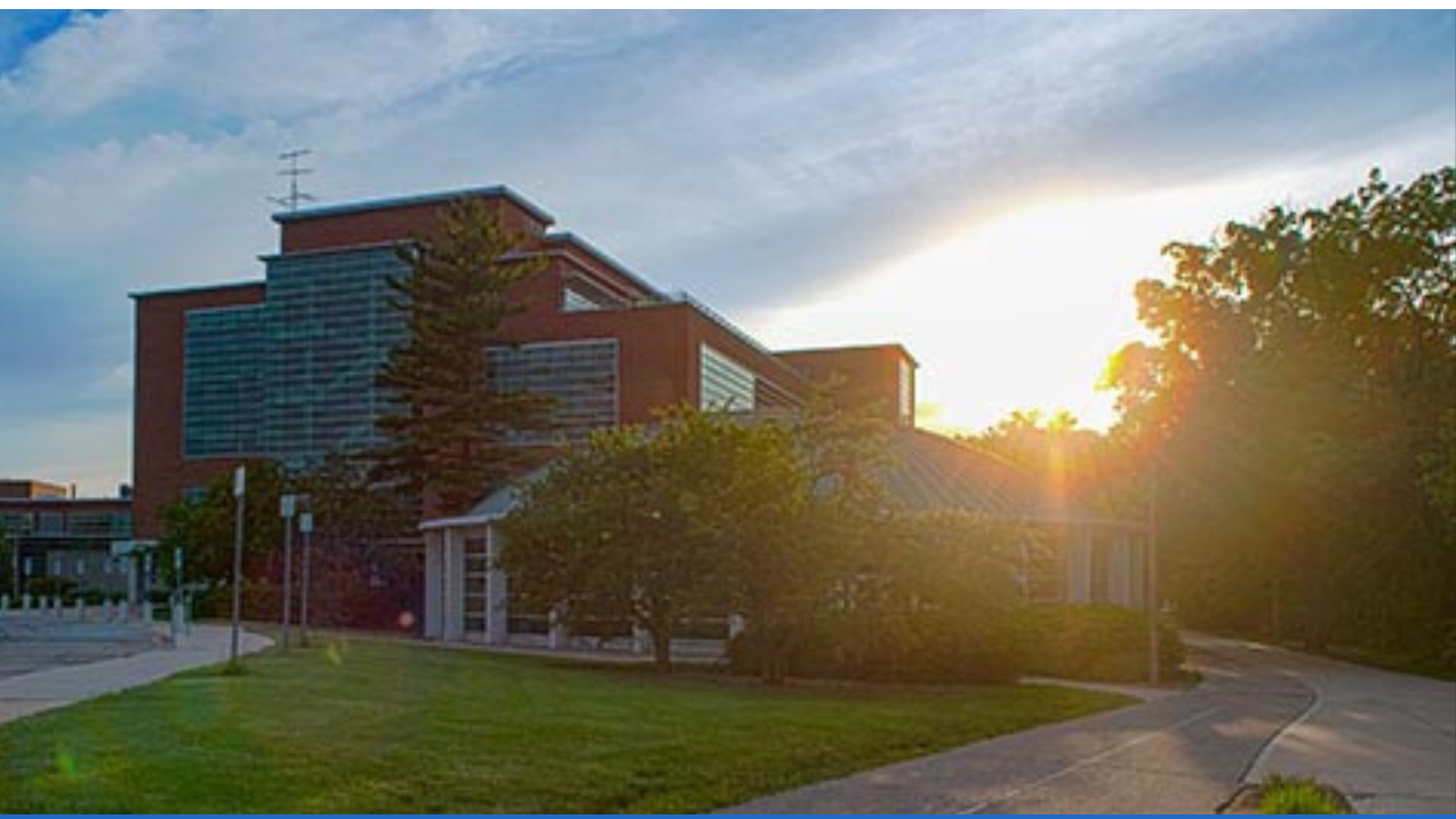 Erickson Hall with sun setting behind it