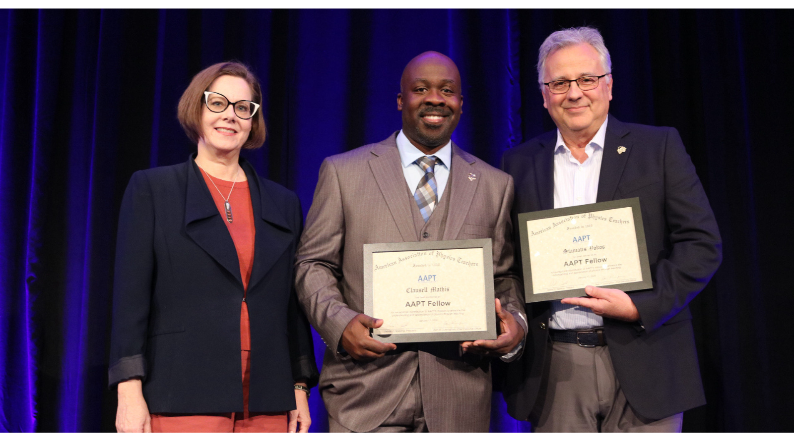 Clausell Mathis reciving AAPT award and two others