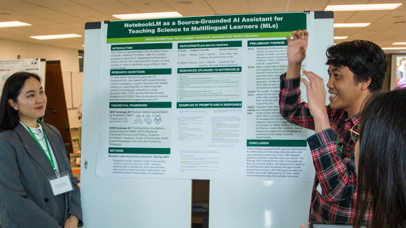 Two presenters discuss poster with an attendee at the 2025 Mini-Conference