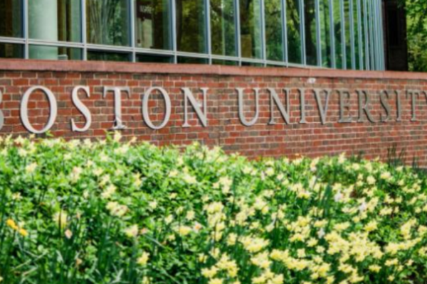 Photo of Boston University building with shrubs in foreground