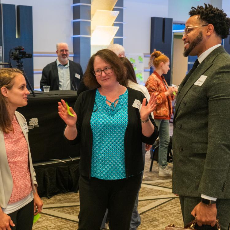 Amelia, Terrance, and attendee