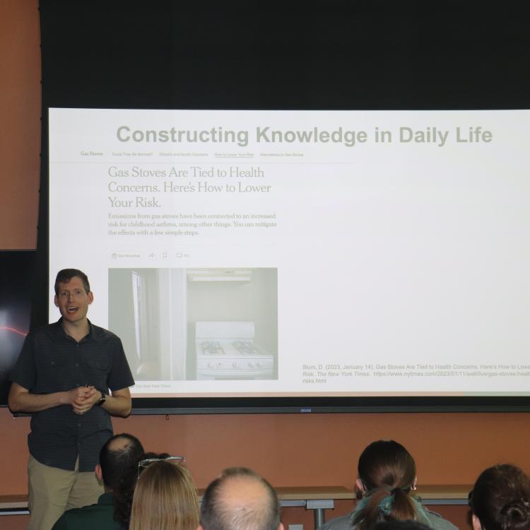 Ryan Stowe presenting slide titled 'Constructing Knowledge in Daily Life'