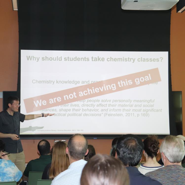 Ryan Stowe presenting slide titled 'Why should students take chemistry classes'