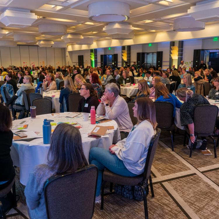 Attendees sitting at tables