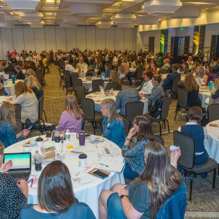 Attendees sitting at tables