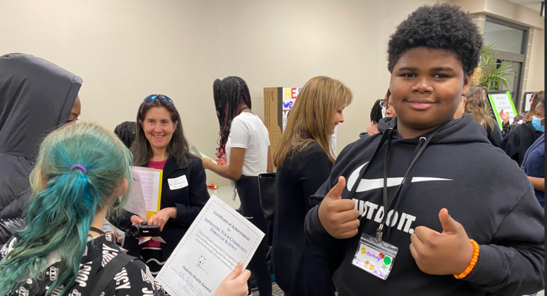 African-American black male middle school student giving 'thumbs up' at the Jan '23 HiOH Summit