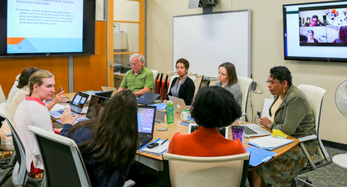 Joe Krajcik and orginal ML team working around a table in CREATE conference room