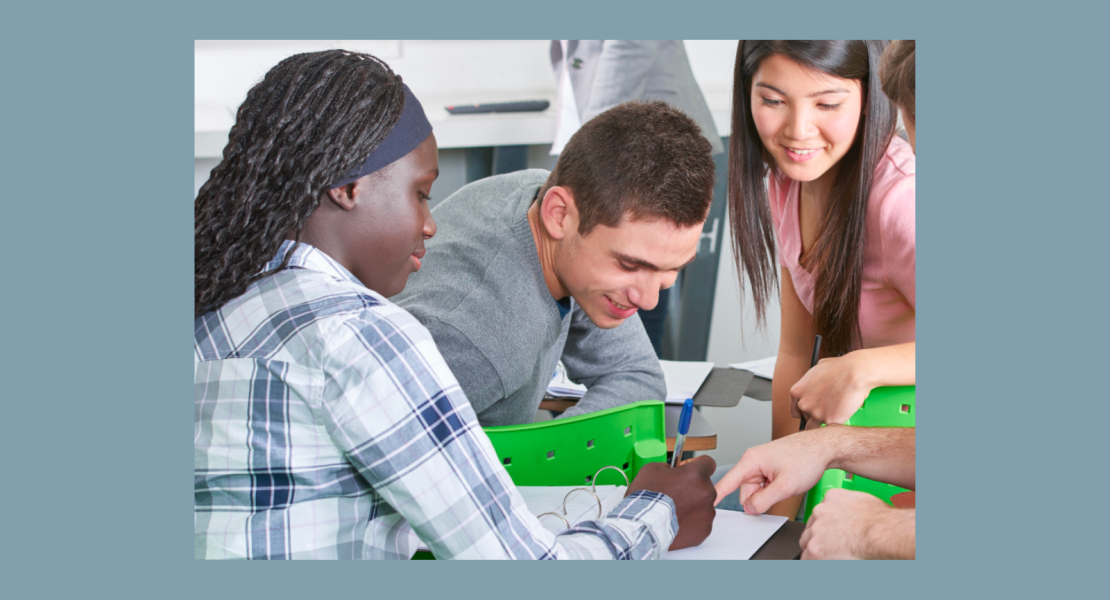 Three middle school students working on project