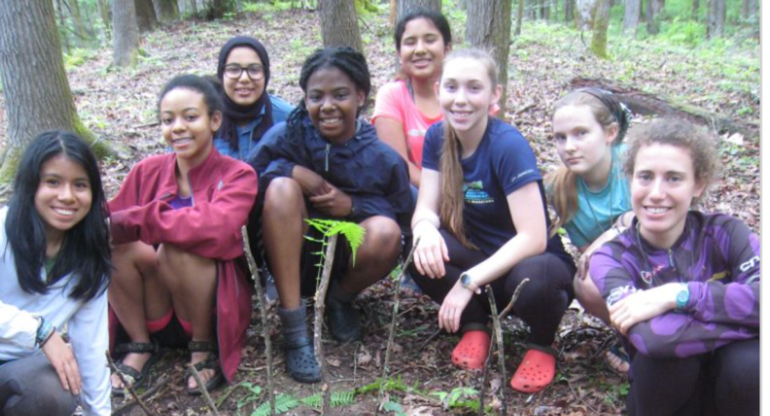 8 girls around plants 