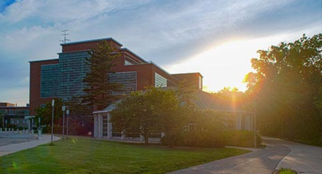 Erickson Hall with sun setting behind it
