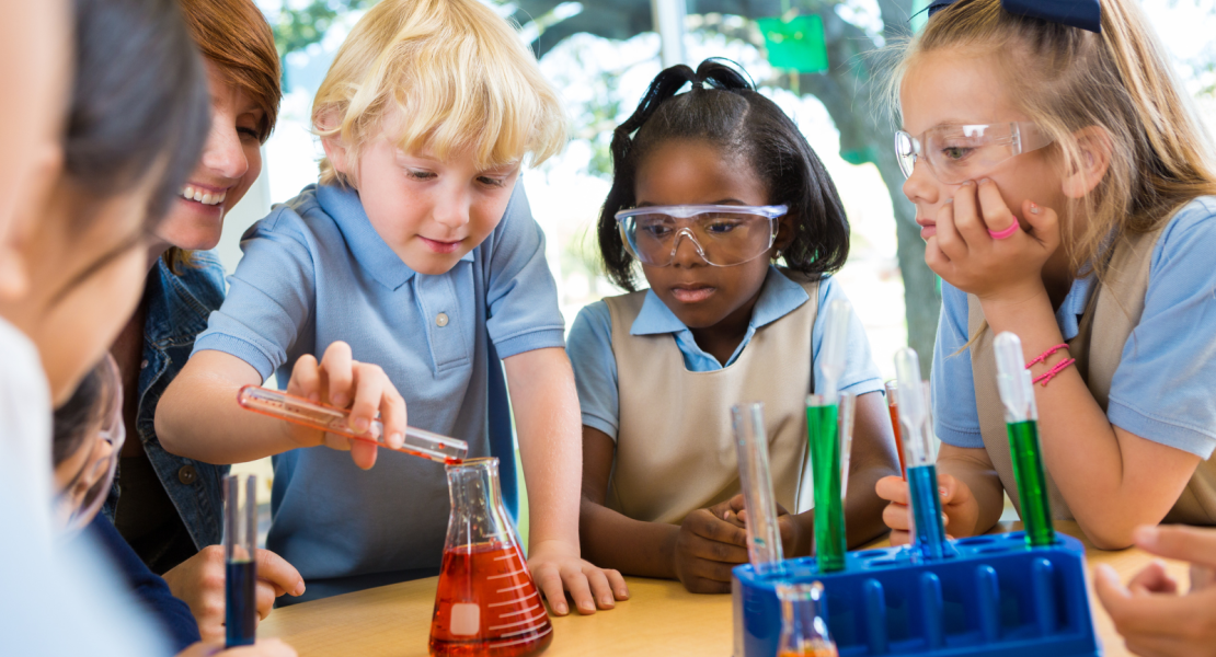 young students working with beakers and liquids